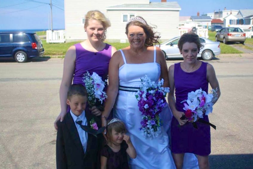 Eliza MacIntyre at her wedding with her daughters Katelyn Young, left, and Candice MacIntyre and her grandchildren Braiden MacIntyre and Leigha MacIntyre. The 51-year-old Glace Bay resident died in a house fire on Saturday in Dominion where she was helping Yvonne Matheson, 83, the other victim of the fire. MacIntyre’s family said she was a kind-hearted woman who was always there to help anyone and everyone.