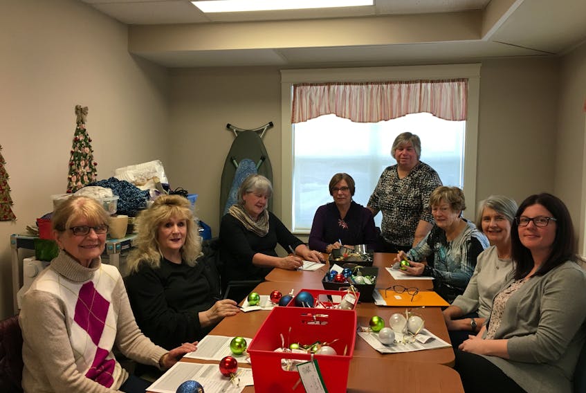 The fundraising committee for the Northside Community Guest Home Foundation is seen preparing the bells for the Northside Guest Home’s annual Bells of Care campaign. From left, Erma Carmichael, Joan Mushbally, Joanne MacNeil, Joan Gallagher, Lila Howell, Corinne MacDougall, Glenda McKeough and guest home fundraising co-ordinator Hailey Marinelli.