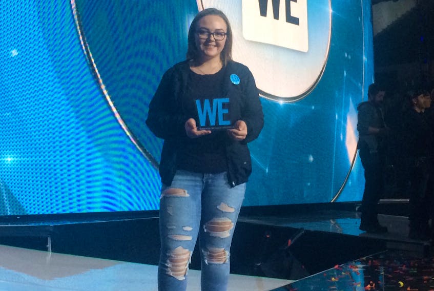Madison Capstick, a Grade 11 student at Glace Bay High School, is shown on stage at the Atlantic Me to We Day in Halifax.  Capstick was one of three students from Atlantic Canada presented with a GenWe award for her hard work with the GBHS ME to WE Group.