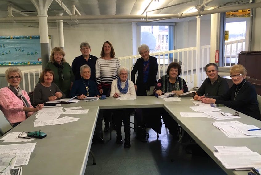 Among those taking part in planning the World Day of Prayer event in North Sydney are, left to right, sitting, Eileen Crews, Donna MacDonald, Mary MacIsaac, Margie Ramsey, Marlene Bailey, Janis Rose and Mary Wilkie and standing, Bernadette Finney, Iris Young, Sis Sheaves and Marjorie Serafinus.