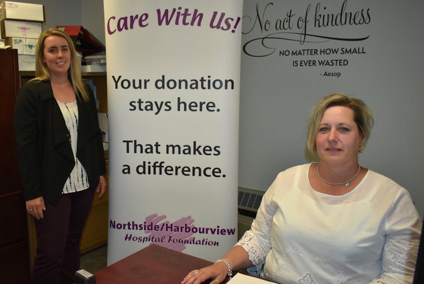 Lauren Hall, left, office manager, and Terri Dennis, executive director, are shown at the Northside Harbourview Hospital Foundation office at the Northside General Hospital in North Sydney on Tuesday. Despite Monday’s announcement of the future closure of the Northside General, the foundation officials expect to continue to operate.