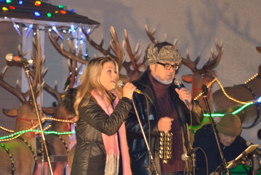 Samantha Gracie, left, is shown performing with her father John Gracie in Wentworth Park in December 2016. The Gracies annual Christmas concert returns to the park Saturday, Dec. 23 at 7 p.m.