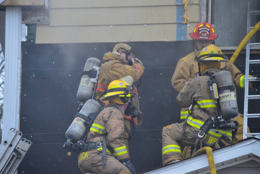 CBRM firefighters are shown wearing masks and air tanks as they prepare to enter a north end Sydney house in this Cape Breton Post file photo. The association representing the municipality’s career firefighters is upset that fire department management didn’t ask for more money in its proposed 2019-2020 budget to deal with firefighter safety issues.
