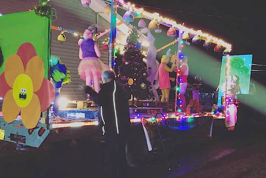 Volunteers with Mullins Rite Stop work on the store's float before one of the Louisbourg Christmas parades. The store's entries were frequent "Best Float" winners and the owners started the petition that was presented to Coun. Amanda McDougall at the Oct. 24 meeting.