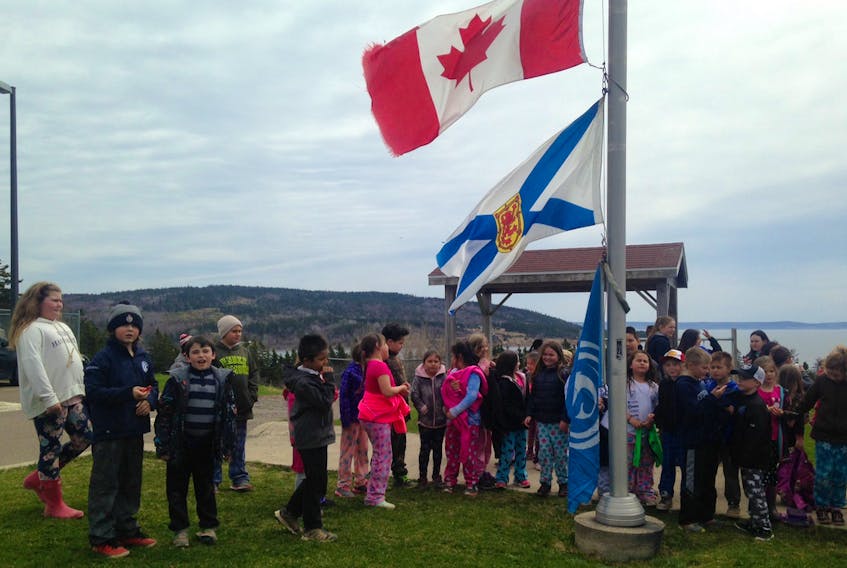 A group of students at Rankin School of the Narrows in Iona attend a flag-raising ceremony on Gaelic Day in May 2017. Rankin is one of the schools in Nova Scotia which offers Gaelic classes.