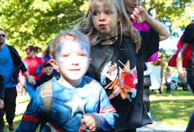 Four-year-old Adrean Parsons was at the Caleb’s Courage event with the Robin Foote Elementary School running club. Smiling as he passed after taking off from the starting line, Parsons didn’t pause for long as he raced with the other superheroes for the golden rocks.