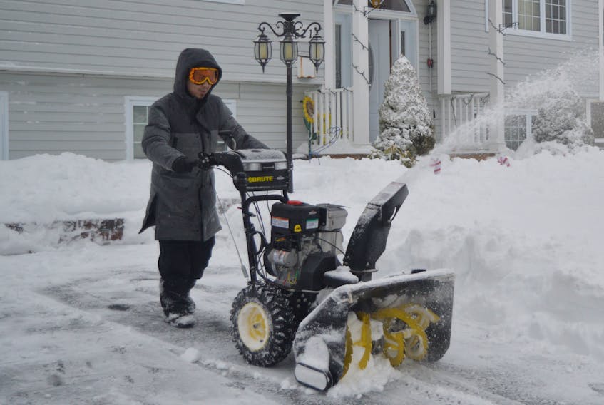 Clearing snow from his south end Sydney driveway was no problem for David Tran, who was more than prepared as he pushed his snowblower while clad in warm winter attire and ski goggles.