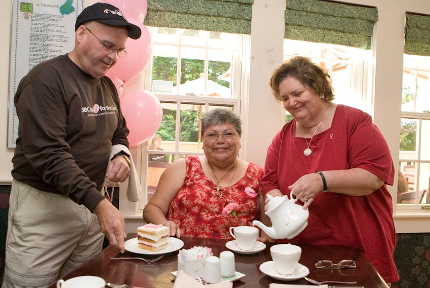 Rita MacNeil serves Neale Morrison, left, co-run director for the CIBC Run for the Cure, and cancer survivor Madeline (Sugar) Poulette some tea and cake during the Pour for the Cure event held at Rita’s Tea Room in 2007.