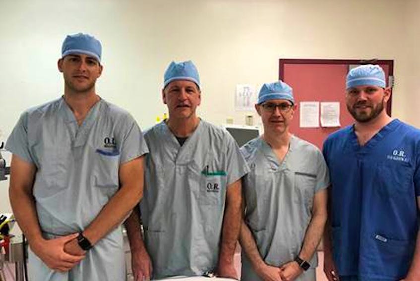 Registered nurse first assistants Jeff Hardy (left) and Matthew Rizzato (right) with clinical preceptors, Dr. Don Brien, orthopedic surgeon (second from left) and Dr. Rod McGory, site lead for surgery at Cape Breton Regional Hospital (second from right).