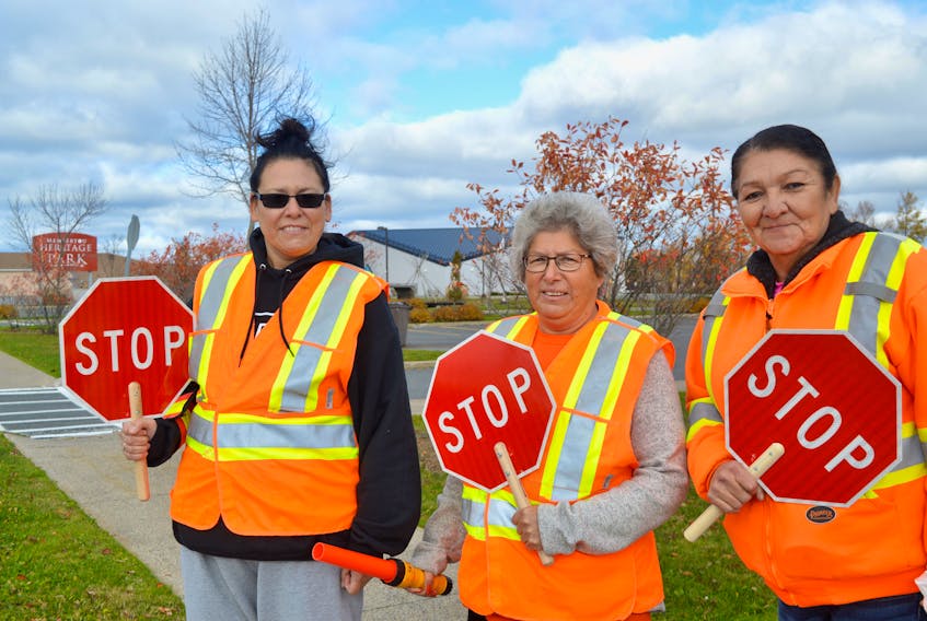 Among those taking part in the Halloween crossing guard program in Membertou are, left to right, June Francis, Laurie Doucette and Marie Gould.