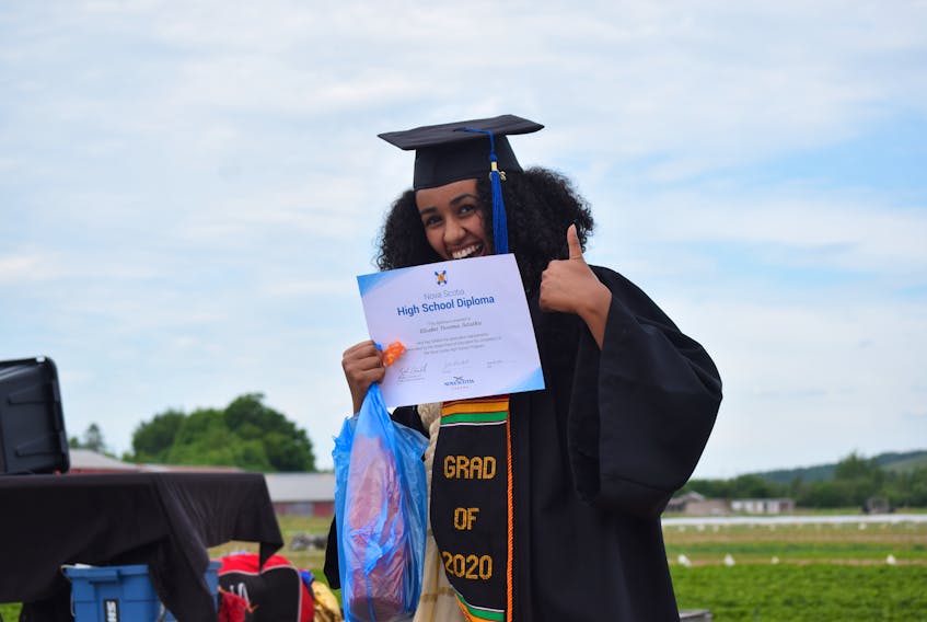 Her expression says it all. Elisabet Tessema Astatkie offers a big thumbs and speaks volumes for the collective mood of the Cobequid Educational Centre's graduating class of 2020, held Friday night (June 26) on the Upper Onslow farm of Jim and Tricia Lorraine.