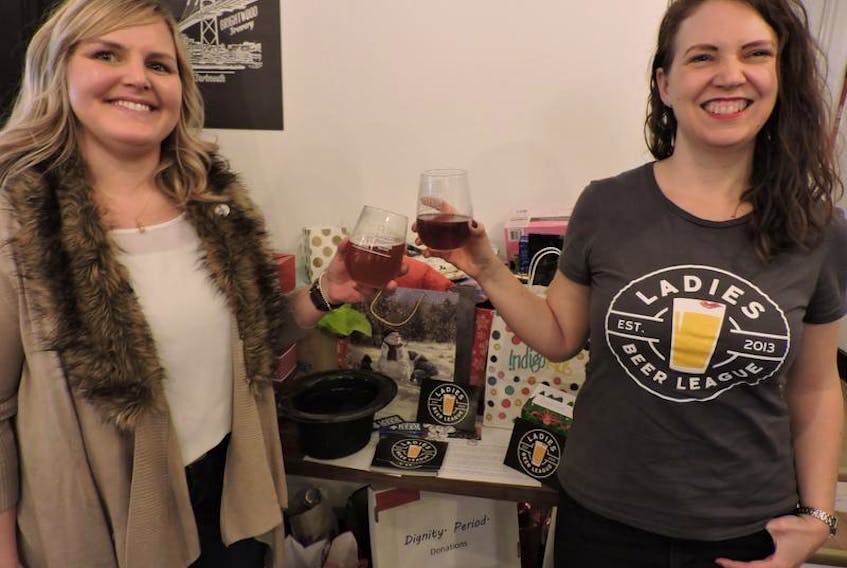 Ladies Beer League organizers Emily Dexter and Meg Stewart raise a toast to the group’s first ever Women’s Christmas celebration on Sunday at downtown Dartmouth’s Brightwood Brewery. Borrowing from the Irish tradition of giving women a break from holiday chores on the 12th day of Christmas, the event included a brewery tour, Yankee swap and fundraising for Dignity Period.