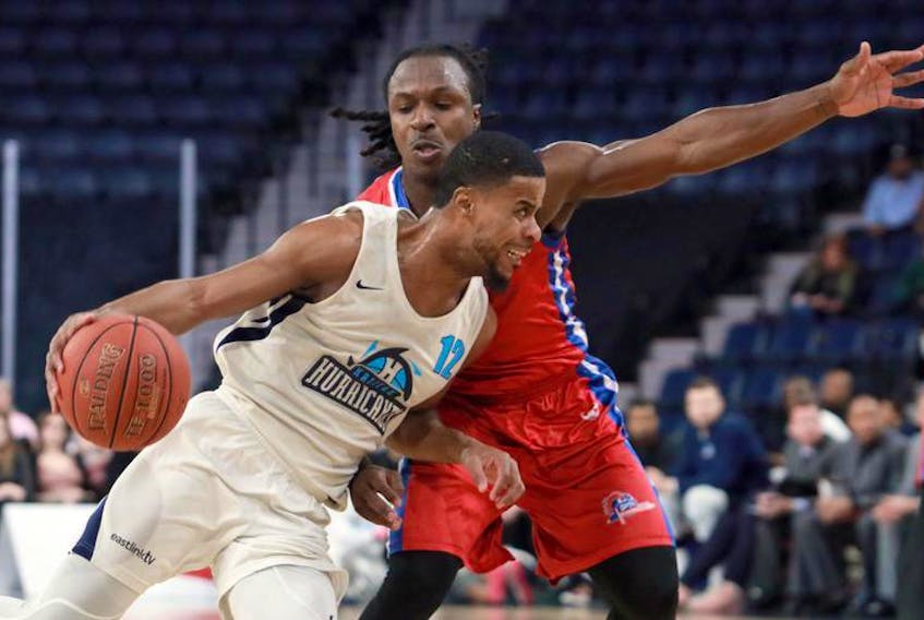 Halifax Hurricanes’ Cliff Clinkscales powers through the defence from Cape Breton Highlanders’ Charles Strowbridge during an April 13 game at Scotiabank Centre.