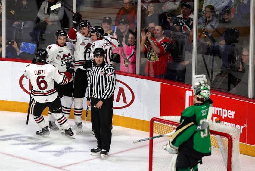 Guelph Storm players celebrate a goal by Fedor Gordeev to open the scoring against the Prince Albert Raiders in Memorial Cup action on Tuesday at Scotiabank Centre.