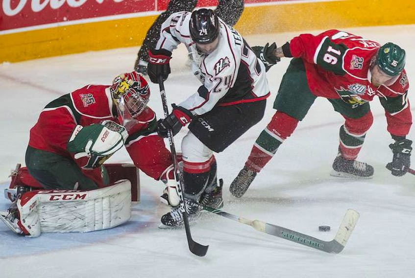 Halifax Mooseheads goalie Alexis Gravel pokechecks Rouyn-Noranda Huskies forward Joel Teasdale during the third period of Saturday’s QMJHL final game at the Scotiabank Centre.