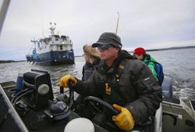 Chris Fischer, expedition leader of the M/V Ocearch pulls up to the vessel off Mosher’s Island, near Riverport, on Tuesday.