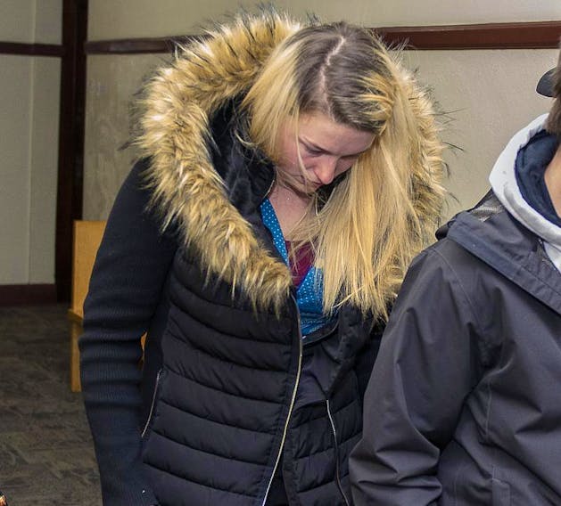 Bethany MacLean leaves a courtroom in Halifax after being sentenced to four months of house arrest for letting a siberian husky starve to death in the parking lot of the Park Lane shopping centre.