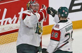Halifax Mooseheads goalie Alexis Gravel and teammate Justin Barron celebrate following their 4-2 victory over the Guelph Storm during Memorial Cup action in Halifax.