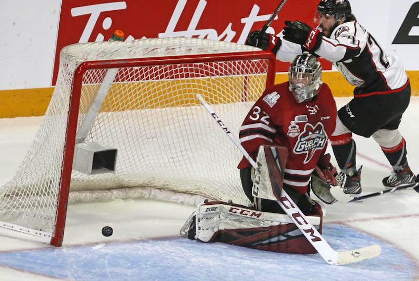 Rouyn-Noranda Huskies forward Joel Teasdale celebrates as the puck slides past Guelph Storm goalie Anthony Popovich for a first-period goal during semifinal action at the Memorial Cup at Scotiabank Centre in Halifax on Friday.