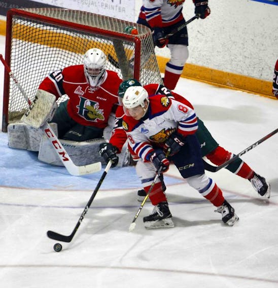 Halifax Mooseheads defenceman Patty Kyte and goalie Cole McLaren keep an eye on Moncton Wildcats forward Jacob Hudson during a QMJHL pre-season game at the Halifax Forum Saturday.