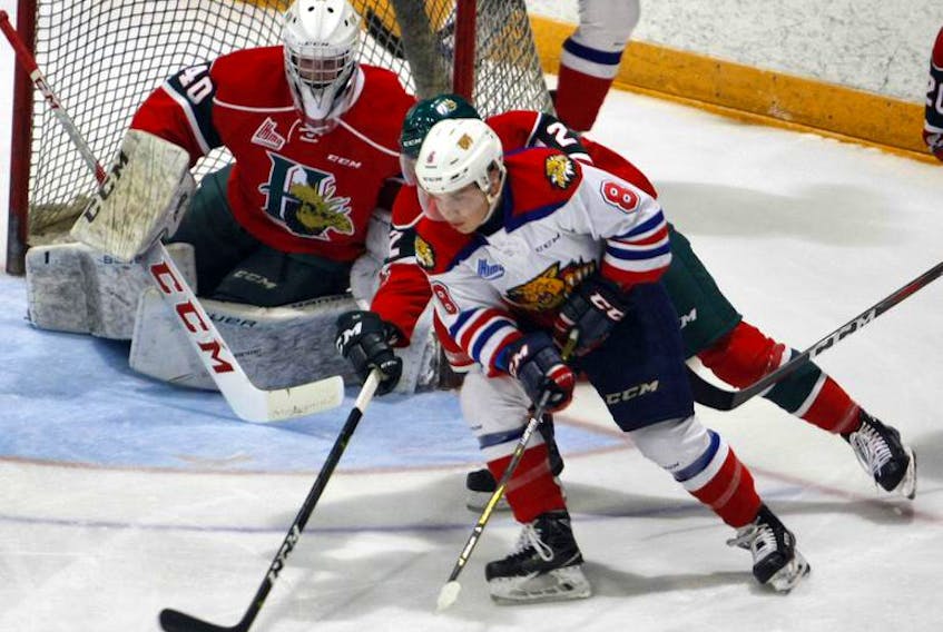 Halifax Mooseheads defenceman Patty Kyte and goalie Cole McLaren keep an eye on Moncton Wildcats forward Jacob Hudson during a QMJHL pre-season game at the Halifax Forum Saturday.