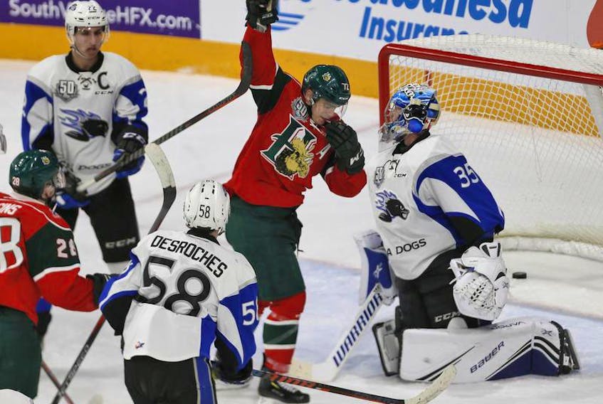 Halifax Mooseheads’ Samuel Asselin celebrates his second goal of the game in front of Saint John Sea Dogs goalie Tommy DaSilva during Friday night’s game at the Scotiabank Centre.