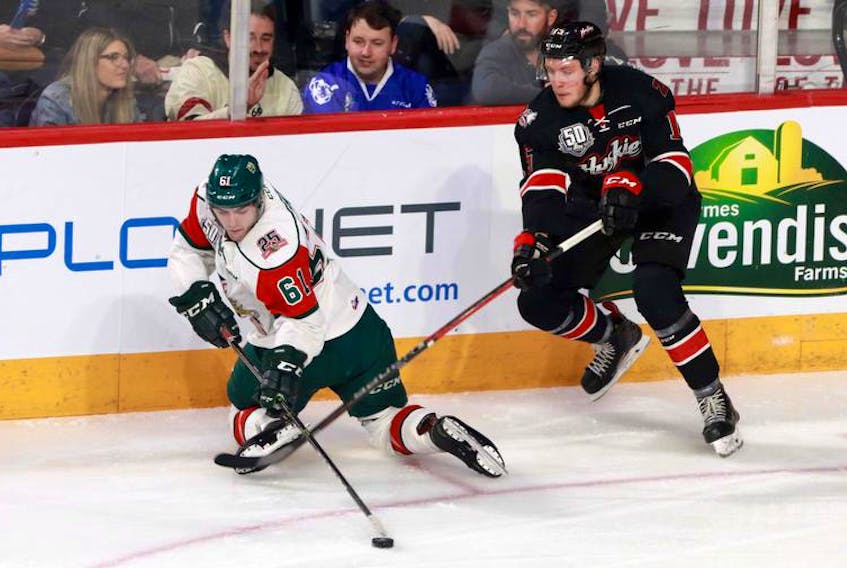 Halifax Mooseheads forward Joel Bishop maintains control of the puck against Rouyn-Noranda Huskies forward Vincent Marleau late in the second period of Wednesday’s Memorial Cup game at the Scotiabank Centre.