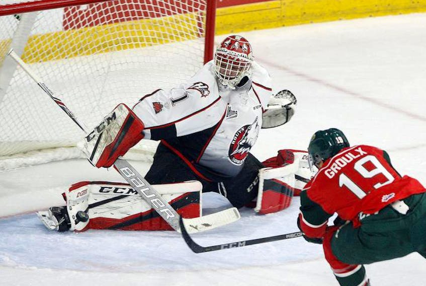 Rouyn-Noranda Huskies goalie Samuel Harvey makes a pad save on Halifax Mooseheads centre BO Groulx during a QMJHL regular season game at the Scotiabank Centre. The teams open their championship series in Rouyn-Noranda on Thursday.