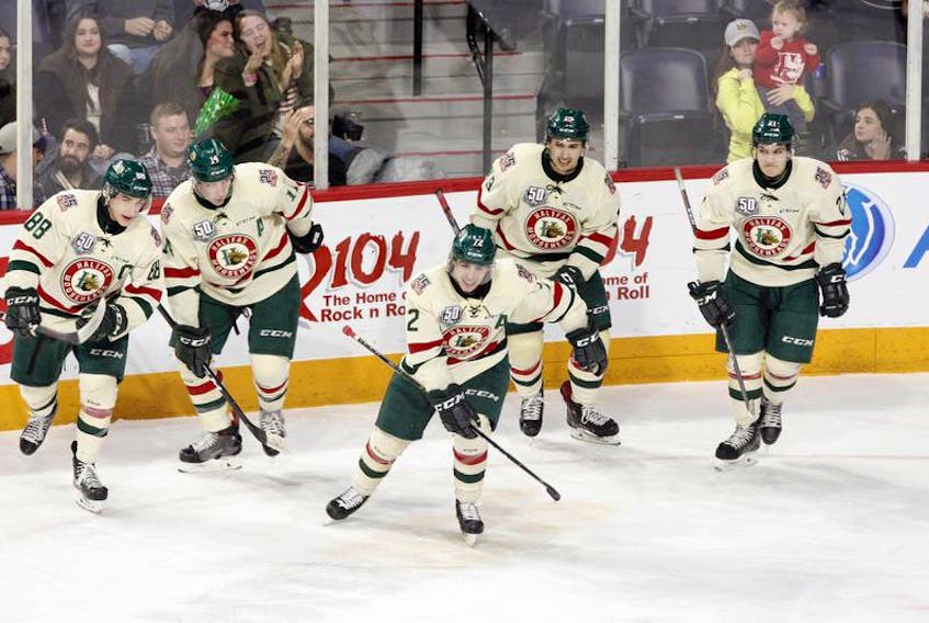Halifax Mooseheads Samuel Asselin, centre, and Antoine Morand, left, won the 2018 Memorial Cup with the Bathurst Titan.
