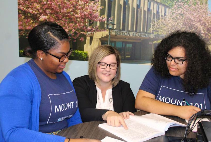 Joyce Wright, left, and Kehisha Wilmot, right, speak with Erin Tomlinson, Mount Saint Vincent University’s manager of the Centre for Academic Advising and Student Success. The Mount 101 program aims to help new students with the transition to university through online supports and mentors.