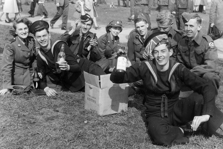 Sailors and soldiers in Halifax celebrate victory in Europe on Friday May 8, 1945. The war would officially conclude with Japan's formal unconditional surrender on Sept. 2, 1945, although fighting ended days before. - Roy Tidman