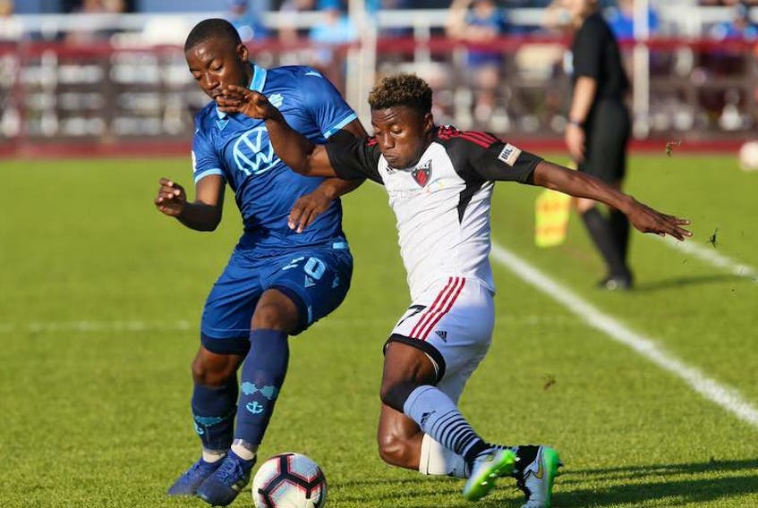 HFX Wanderers FC striker Akeem Garcia, left, and Ottawa Fury FC’s Christiano Francois do battle during Canadian Championship action in Halifax on July 10 at the Wanderers Grounds.
