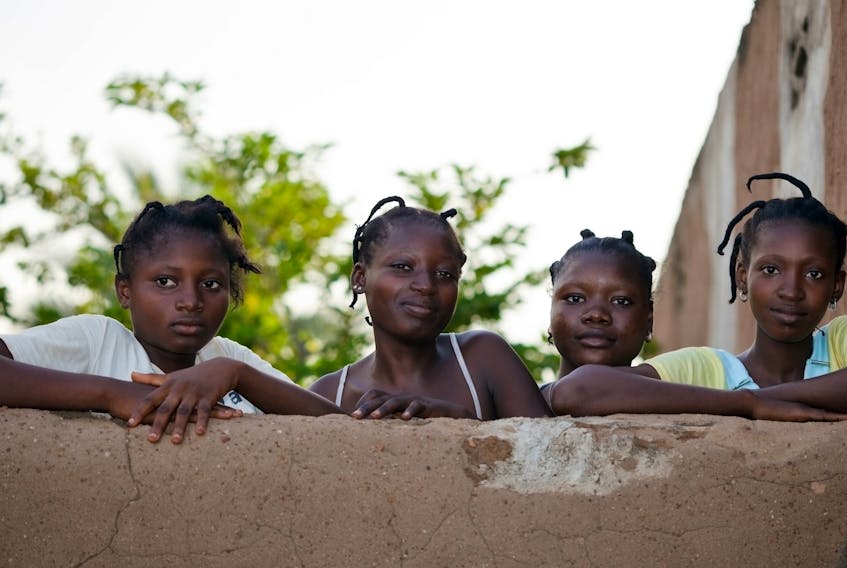 Four girls pose for a photo in Burkina Faso on Aug. 9, 2009.