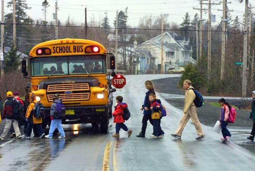 A school bus stops for students in this file photo.