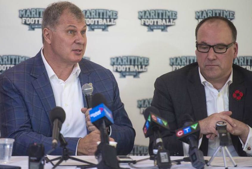 CFL Commissioner Randy Ambrosie answers questions from reporters during a news conference at Saint Mary’s University as Maritime Football Limited founding partner Anthony LeBlanc listens on Wednesday afternoon. Maritime Football announced a season-ticket drive for a potential CFL team as well as a name-the-team contest.