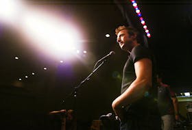 Colin James stopped by St. Pat's High School on July 19, 2004, where a summer rock camp was being held. The Canadian musician held a question and answer session with participants and briefly toured the facilities.