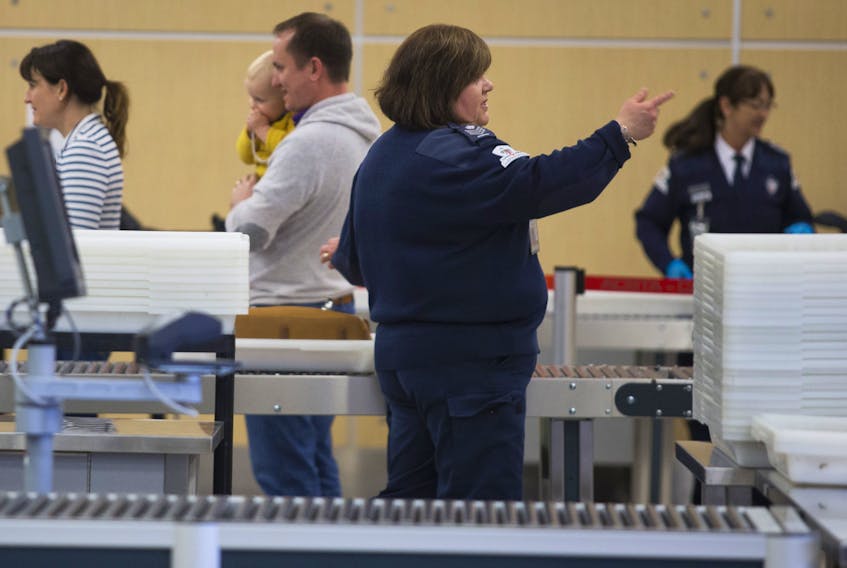 Travellers pass through security at Halifax Stanfield International Airport on March 11, 2015.