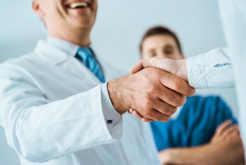 Stock photo of doctors shaking hands.