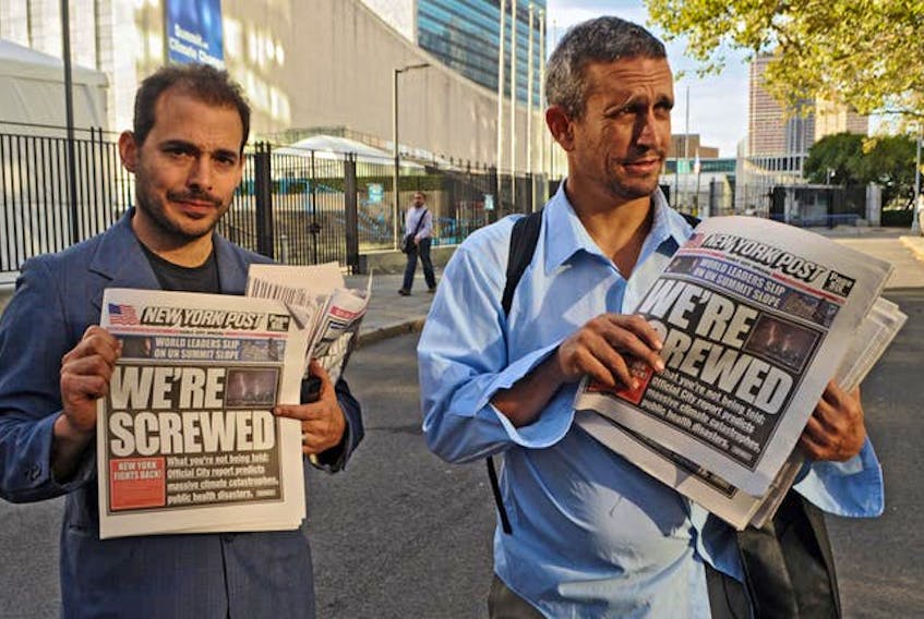 The Yes Men in 2009 handing out spoof editions of the ‘New York Post’ with the lead story ‘We’re Screwed’ outlining how “climate change is threatening the lives of New Yorkers — especially those who take the subway to work.”