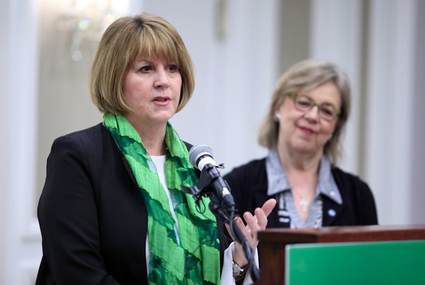Deputy leader of the Green Party of Canada Jo-Ann Roberts speaks as party leader Elizabeth May looks on in Halifax on March 19, 2018.