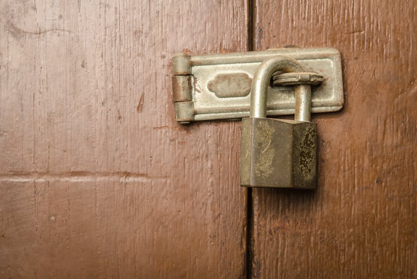 A door locked by padlock.