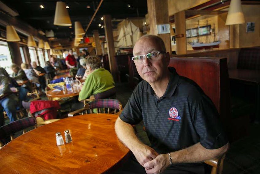 Mike Mawhinney, owner of the Old Fish Factory is seen in the restaurant in Lunenburg, is concerned that two recent power outages are affecting his bottom line. One recent outage was for six hours in length.
