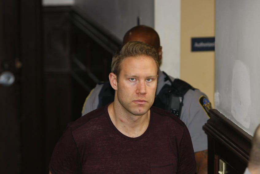Matthew Ross Lambert of Richmond, B.C., is shown at Halifax provincial court July 3 after his arrest in connection with a cocaine seizure. He now faces a new charge of money laundering. - Eric Wynne