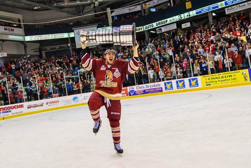 Samuel Asselin raises the President Cup after helping the Bathurst Titan clinch the 2018 QMJHL championship on May 13. The Halifax Mooseheads acquired the 20-year-old forward on Friday. -Vincent Ethier