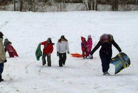 Although the snow we received Tuesday was a pain for drivers, for the children of Halifax the white stuff provided them a chance to enjoy sledding and hanging out with friends. A group of children and parents enjoyed the morning sledding down the hill at Flinn Park in Halifax.