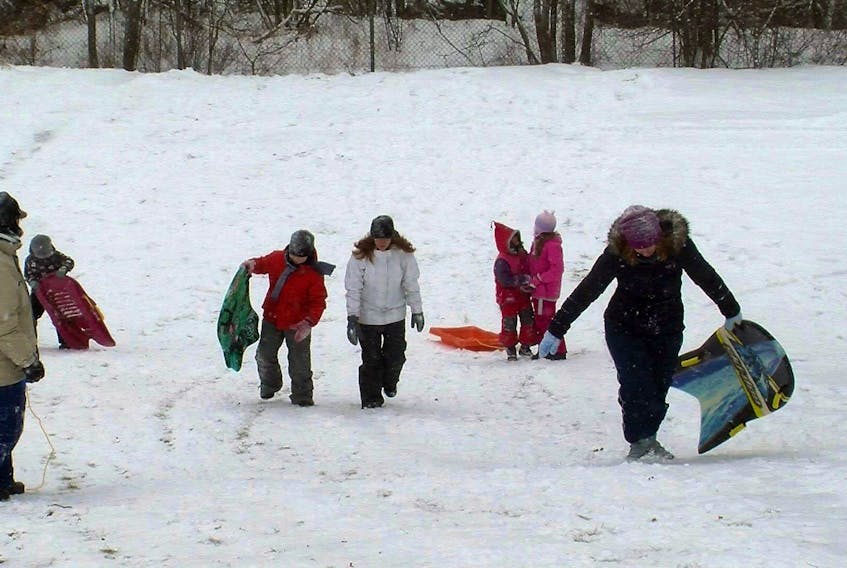 Although the snow we received Tuesday was a pain for drivers, for the children of Halifax the white stuff provided them a chance to enjoy sledding and hanging out with friends. A group of children and parents enjoyed the morning sledding down the hill at Flinn Park in Halifax.