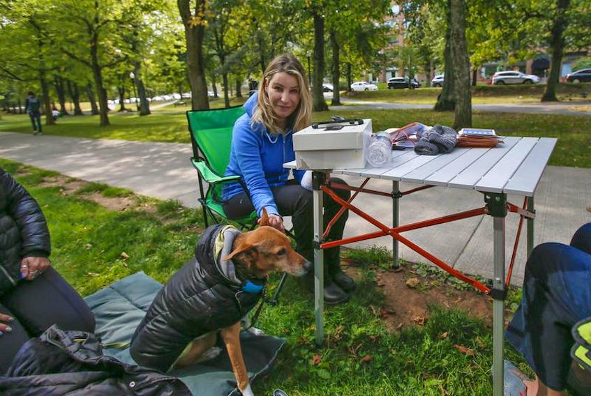Shannon Nickerson, is seen with her dog, Pedro, in Victoria Park in Halifax Tuesday September 25, 2018. Nickerson began a hunger strike on Sunday to help draw attention for her request to have a public inquiry into current labour laws. She alleges that she encountered harassment while teaching at SMU.