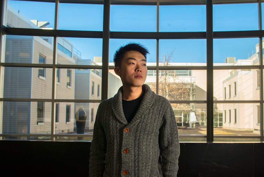 Wang Yijie, a second-year applied computer science student at Dalhousie, poses for a photo inside the Marion McCain on the university campus Tuesday afternoon.