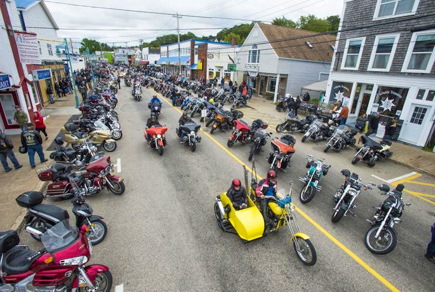 Motorcyclists drive down the main street of Digby during the Wharf Rat Rally in 2017.