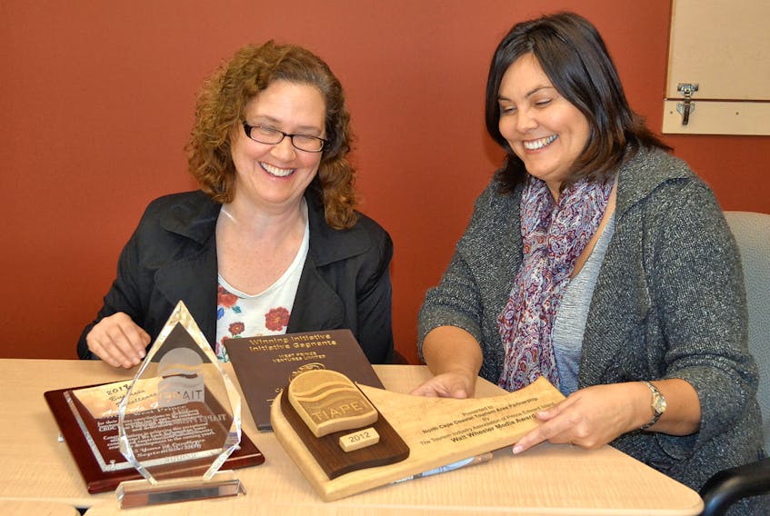 Carol Rybinski, left, West Prince Chamber of Commerce secretary and awards committee member, and Tammy Rix, the Chamber’s executive director, examine award plaques for design ideas for their 2017 Business Excellence Awards gala. Five awards will be presented during the Feb. 22 dinner. ERIC MCCARTHY/JOURNAL PIONEER